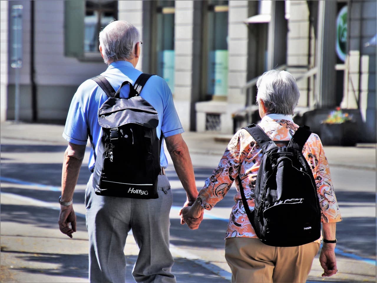 A couple walking together, hand in hand